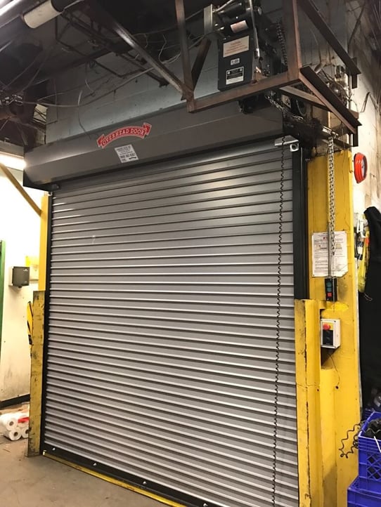 Rolling Door Gate Red Zone for Install and Service; rolling door service picture; gray rolling doors. Rolling Door Gate Red Zone for Install and Service; rolling door service picture; gray rolling doors.