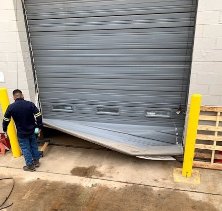 Broken Commercial Door That Needs Repair - Overhead Door in NYC