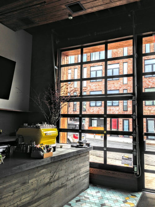 Den_Brooklyn_interior_view_metal_glass_garage_door_brooklyn.jpg