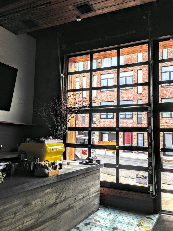Den_Brooklyn_interior_view_metal_glass_garage_door_brooklyn.jpg Den_Brooklyn_interior_view_metal_glass_garage_door_brooklyn.jpg