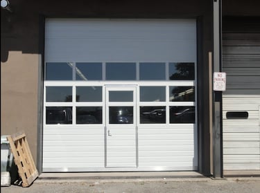 Sectional Door with Pass-Through Door; White Sectional Door with Pass-Through Door and glass panels