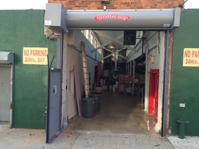 nj_rollup_gate_with_man_pedestrian_traffic_passenger_hollow_metal_door_service_entrance.jpg