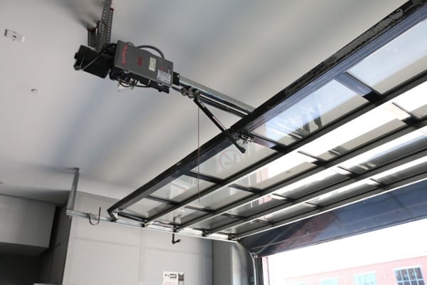 Sectional Parking Garage Door with Trolley Mount Drawbar Operator